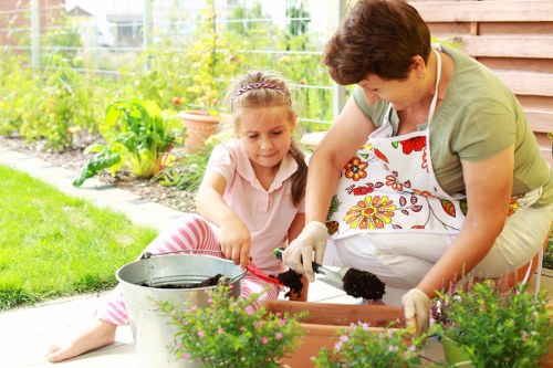 Compost bins and separated recycling containers in a sustainable gardening area